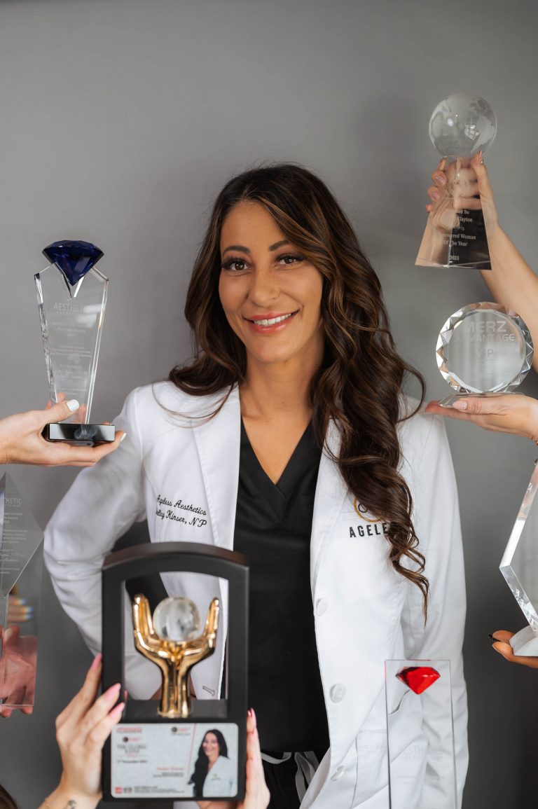headshot of Shelley Clayton with awards