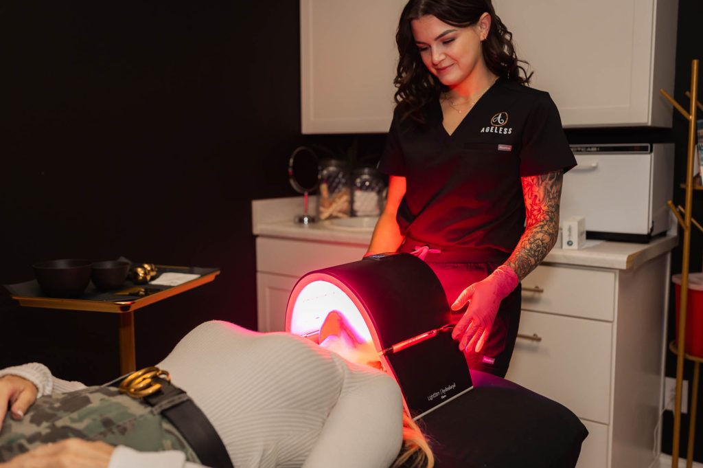 woman receiving red LED light therapy