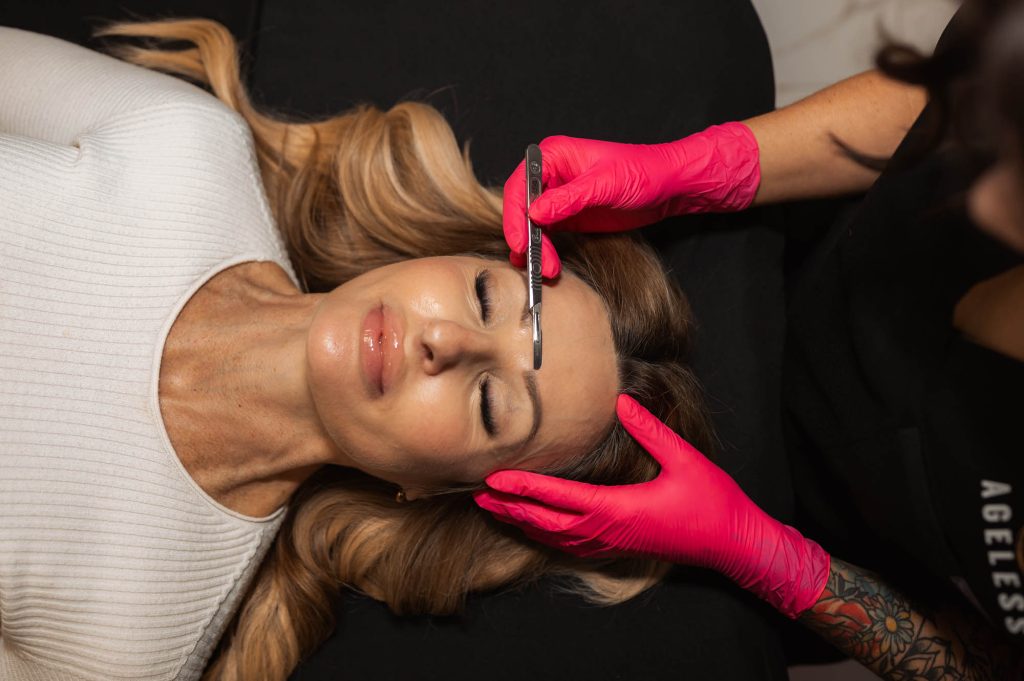 woman receiving dermaplaning facial in Indianapolis